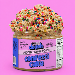 Jar of Twisted Dough Confetti Cake protein cookie dough with colorful sprinkles on a pink background