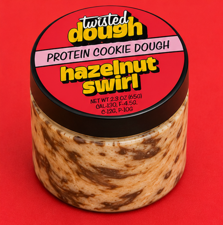 Jar of 'Twisted Dough' protein cookie dough with hazelnut swirl on a red background
