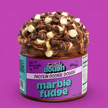 Load image into Gallery viewer, Jar of Twisted Dough Protein Cookie Dough with chocolate chips on a purple background