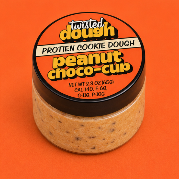 Jar of Twisted Dough Protein Cookie Dough Peanut Choco-Cup on an orange background