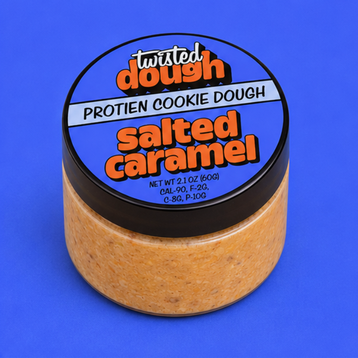 Jar of Twisted Dough Protein Cookie Dough in salted caramel flavor on a blue background